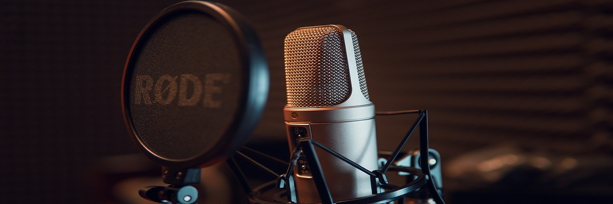 Professional internet radio broadcasting studio with DJ mixing console streaming equipment and audio interface